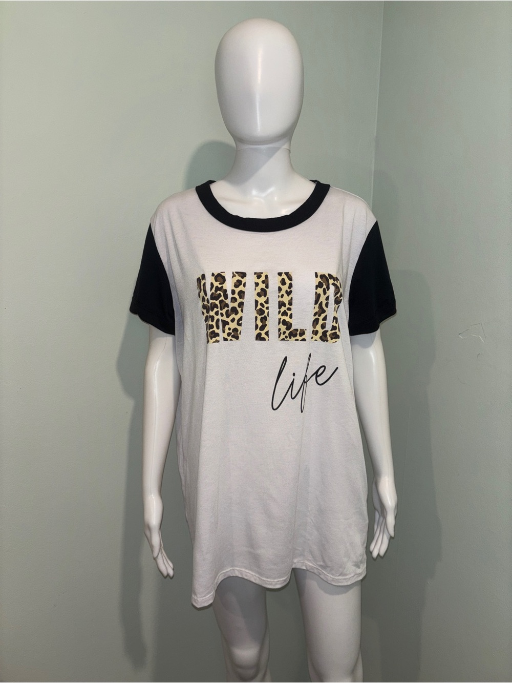 LulaRoe Liv White & Black Animal Print Wild Life Short Sleeve T-Shirt - L